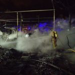 Firefighters extinguish a fire at Bolnuevo campsite in Mazarrón